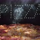Delicious Fresh Italian Pizza On  A Black Background With The Effect Of Light Inscription Pizza - VideoHive Item for Sale
