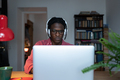 Unhappy tired young African student guy looking at laptop feeling overwhelmed with online classes - PhotoDune Item for Sale