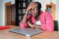 Depressed sad young African student guy feeling lazy and unmotivated to study online - PhotoDune Item for Sale