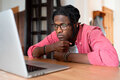 Upset depressed African guy freelancer experiencing apathy and demotivation during remote work - PhotoDune Item for Sale