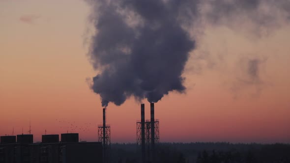 Dark smoke comes from the boiler room chimney.