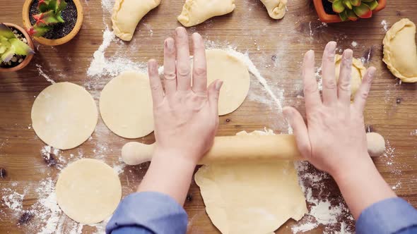 Flat lay. Step by step. Rolling dough for home made empanadas.