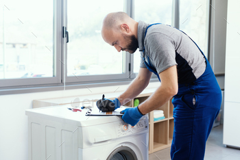 epairing a washing machine, home repair concept