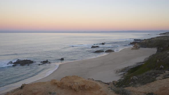 Praia do Malhao beach view at sunrise, in Portugal