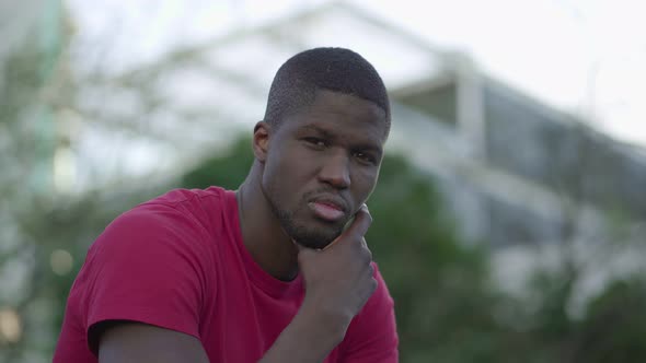 Man Touching Chin, Turning Head To Camera, Looking at Camera