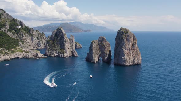 Luxury Yacht Boats by Faraglioni Rocks off Island of Capri, Italy, Aerial