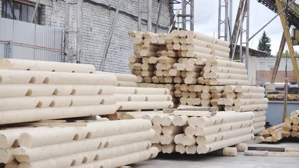 Round Timber Logs for Building Wooden House. Removing Bark From Logs Using a Machine. Pattern of