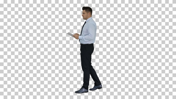 Elegant Young Businessman Using Tablet While Walking, Alpha Channel