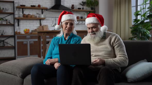 Happy Old Couple Chatting with Family at Distance