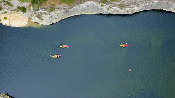 Aerial drone view following kayaks. 