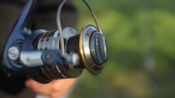 Close-up of Fishing Line Reel During Fishing