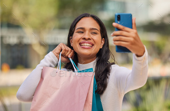 Phone, selfie and shopping with woman in a city with happy, relax and smiling shopper holding shopp