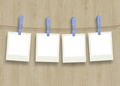 plastic clothespins and instant frame against wooden Backround - PhotoDune Item for Sale