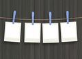 plastic clothespins and instant frame against wooden Backround - PhotoDune Item for Sale
