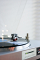 Close-up of vinyl record player, playing Christmas carols. Bokeh lights in the background. - PhotoDune Item for Sale