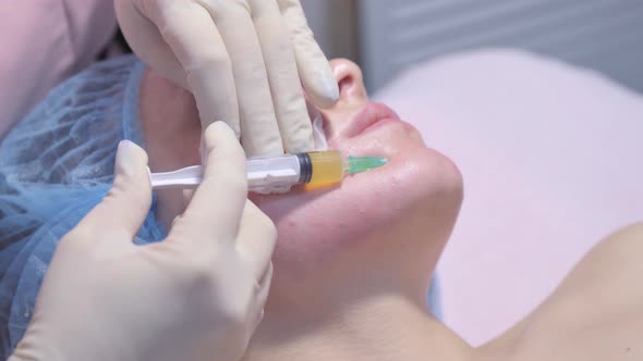 Woman on the Procedure of Mesotherapy Injection