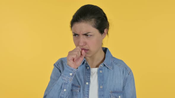 Sick Indian Woman Coughing, Yellow Background 