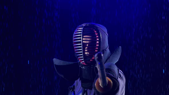 Japanese Kendo Fighter Lowering His Shinai Towards Camera