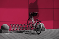 Various bikes for rent in a row parked. New 2023 trending PANTONE 18-1750 Viva Magenta colour - PhotoDune Item for Sale