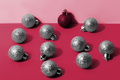 red christmas ball among blue balls. New 2023 trending PANTONE 18-1750 Viva Magenta colour - PhotoDune Item for Sale