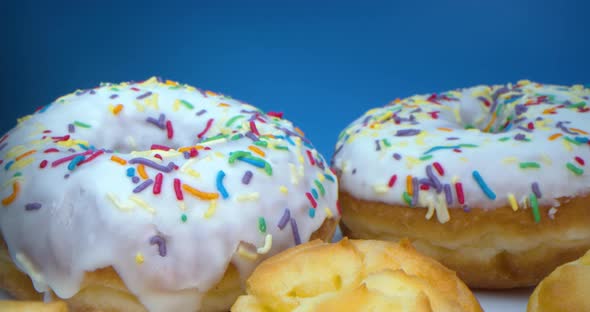 Super Macro Closeup Shot of Delicious Sweet Donuts with Colorful Frosting and Donuts with Cream