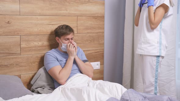 Female Doctor is Listening to Breath of Male Patient