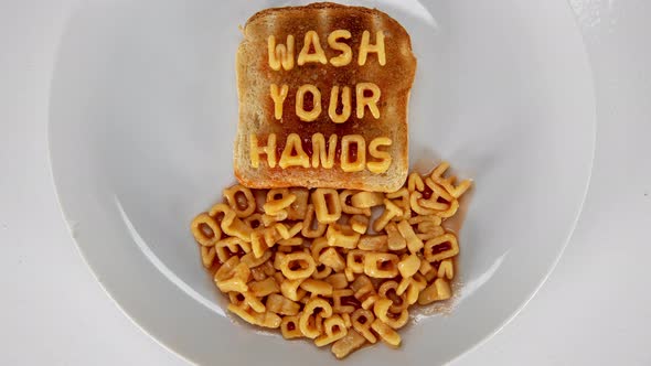 Spaghetti Letters On Toast Saying Wash Your Hands.