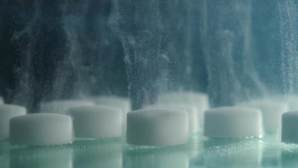 Closeup of White Tablets in Water Dissolving