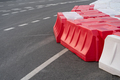 Temporary road barriers installed on asphalt with intermittent markings to prevent accidents - PhotoDune Item for Sale