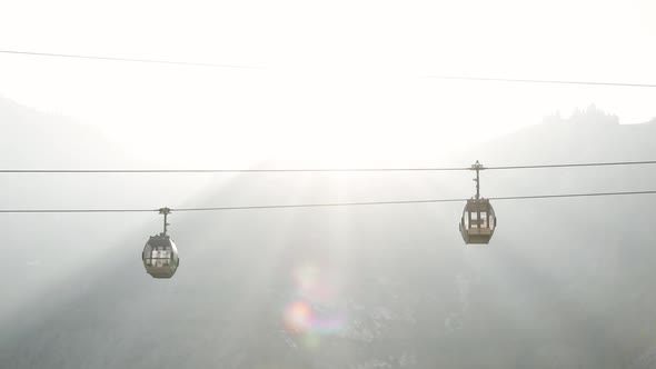 Cable Car in Silhouette the Mountains Sunset Background