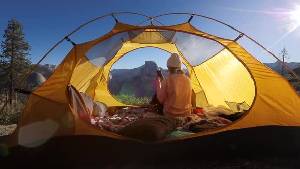 The Tourist Shoot with a Smartphone the View of the Half Dome Cliff Through the Window in the Tent.