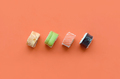 Different types of asian sushi rolls on orange background - PhotoDune Item for Sale