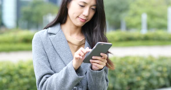 Woman use of mobile phone at night