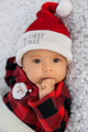 Newborn baby dressed in cozy Santa outfit, closeup portrait of infant girl on soft white background - PhotoDune Item for Sale