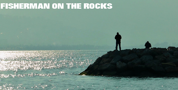 Fisherman On The Rocks