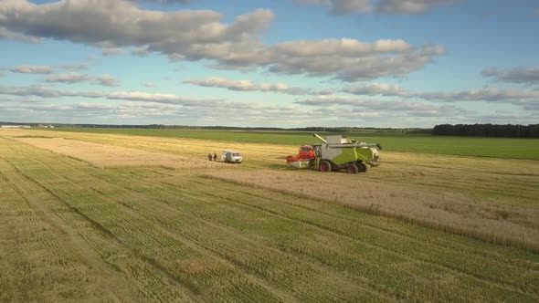 Flycam Removes From Harvesters Minivan and People on Field