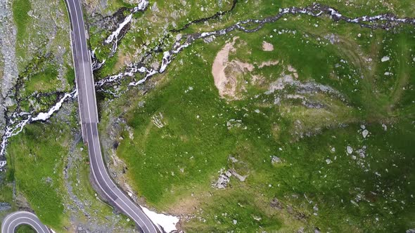 Curved Road Into Mountains With River