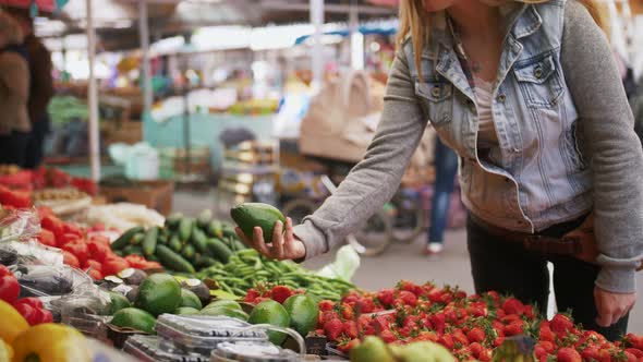 Young Attractive Woman Choosing Organic Fruits at Farmer's Market Close Up Shot Slow Motion