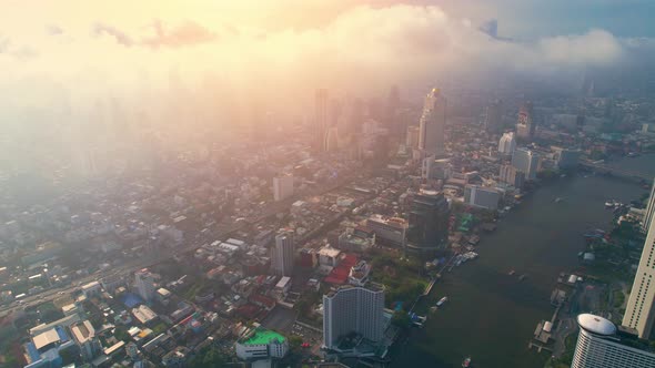 4K : Aerial view over Bangkok city and Chao phraya river. Cinematic drone shot.