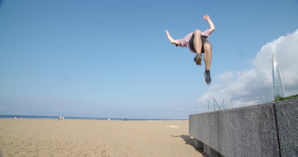 a Young Man Engages in Parkour Does Somersaults Through Himself but Unsuccessfully Falls Crushingly