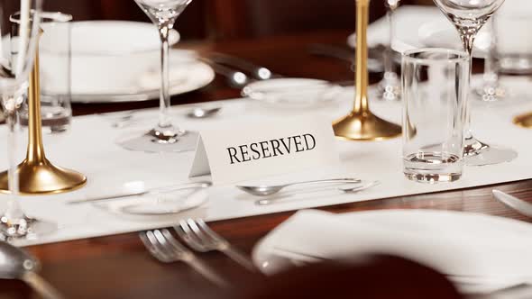 Reserved table card closeup. Animation of elegant tableware at a restaurant.