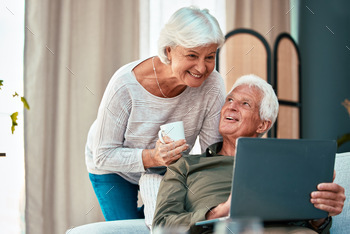 Senior couple, laptop and happy at. home on lounge sofa talking and reading online for online shopp