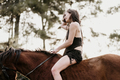 Close-up of a girl riding a horse. - PhotoDune Item for Sale