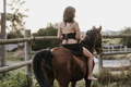 Amazon girl riding a horse in black dress. - PhotoDune Item for Sale