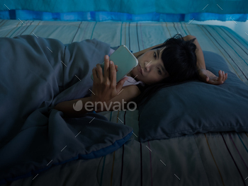 rl Insumnia Sleep She Stressed and Holding Smartphone in Bedroom,Use Mobile with Insufficient Lighting,