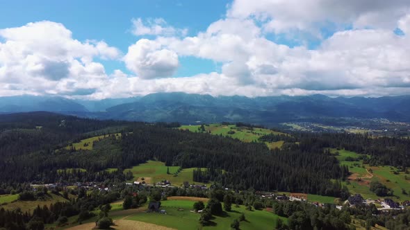 Flight Over a Mountain Cottage Village in Poland, Zakopany, Tatra National Park Aerial 4K Video