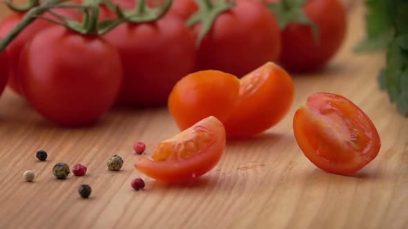 Slices of Ripe Tomato Falling on the Table