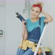 Happy Woman with Drill Sitting on Stepladder - VideoHive Item for Sale