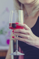 Female hand holding glass of rose wine, closeup - PhotoDune Item for Sale