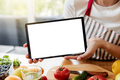 Woman hands at kitchen showing tablet with empty blank screen mockup - PhotoDune Item for Sale